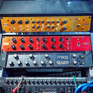 Vertigo Sound and Moog rack units in the Zombie Nation studio rack, orange and red faceplates stacked