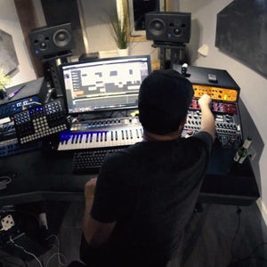 Zombie Nation studio session from above, Cubase open on screen with Genelec monitors and Eurorack modular