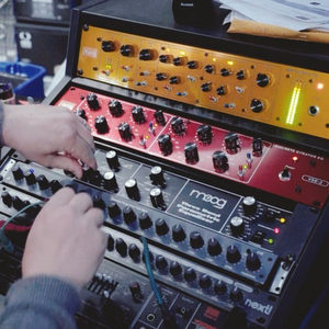 Hands on the Moog Grandmother synthesizer in a Zombie Nation outboard rack with Discrete Strator EQ above