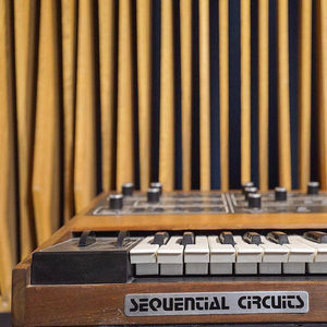 Angled close-up of a Sequential Circuits Prophet-5 synthesizer with acoustic diffuser rods in the