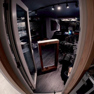Studio door open to reveal Zombie Nation rack gear on the left and coiled cables on the right, fisheye view