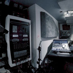 Zombie Nation studio from the doorway, fisheye lens, synth racks left, cables and road cases right