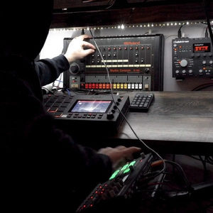 Zombie Nation studio Roland TR-808 drum machine with Akai MPC Live in the foreground, Elektron in