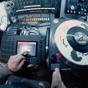 Zombie Nation studio with Roland TR-808 drum machine on a rack, Akai MPC Live and a turntable in the