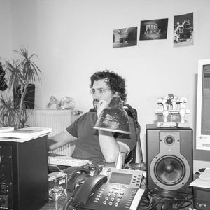 Early career portrait at the UKW Records office in Munich, 2008, speaker monitors and mixing gear on desk