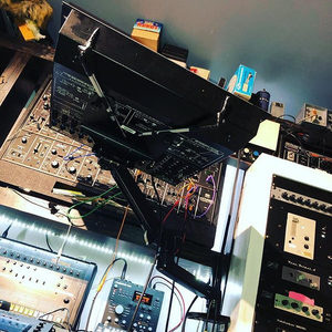 Zombie Nation studio with Neve Portico rack wall, mixing console, Genelec monitors and acoustic treatment