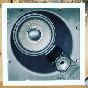 Teenage Engineering OD-11 speaker removed from housing, woofer and angled tweeter visible for cleaning